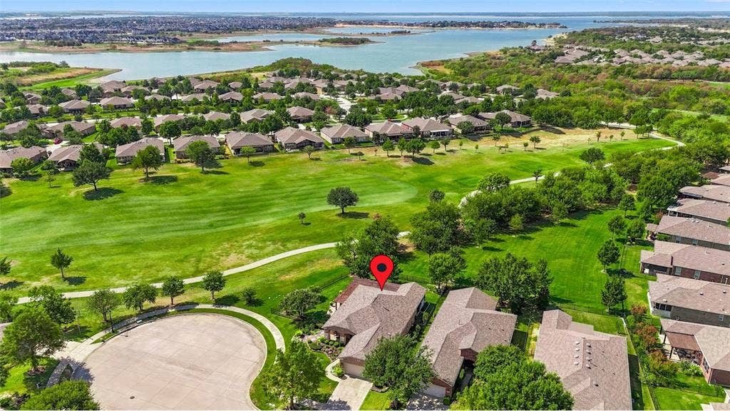 1641 Overwood Drive, Frisco, TX 75036 Cul-de-Sac location with lush green landscaping, a golf course, and a large body of water define the surrounding area