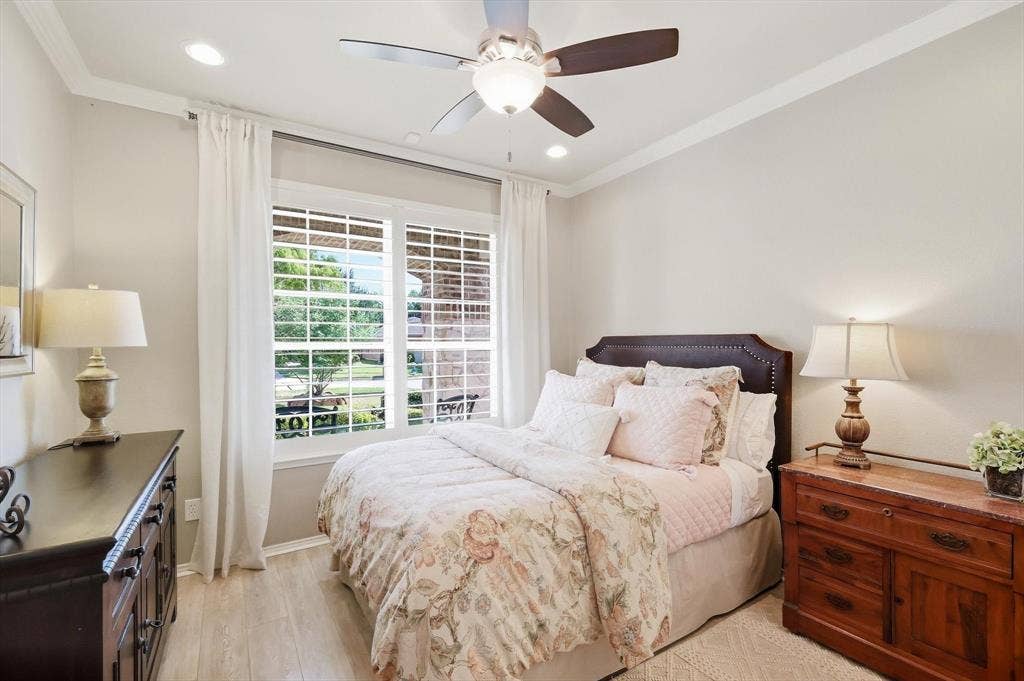 1641 Overwood Drive, Frisco, TX 75036 Recessed lighting, crown molding, wood-finish flooring, ceiling fan, and window with plantation shutters