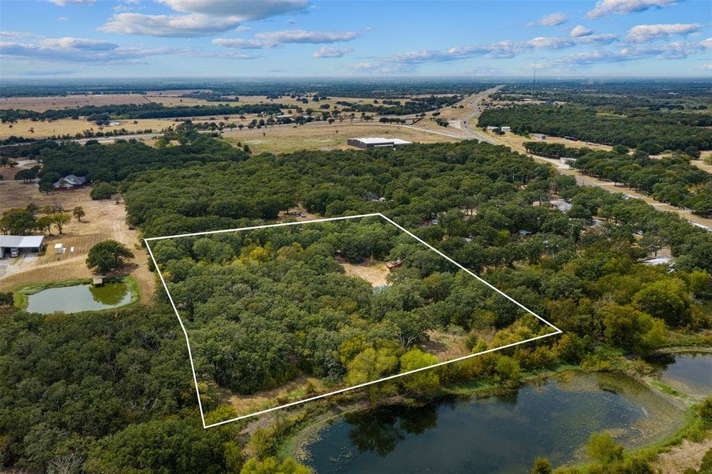 172 M Burton Street, Riesel, TX 76682 Expansive land parcel featuring dense tree coverage