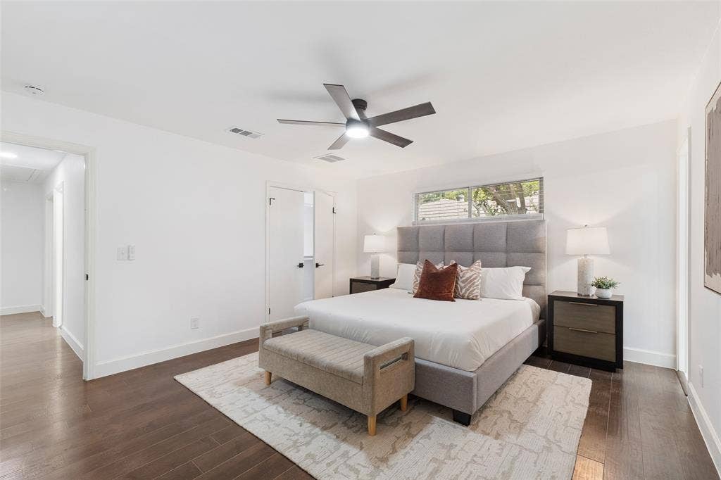 1612 Northcrest Drive, Plano, TX 75075 Spacious room featuring wood-finish flooring, a contemporary ceiling fan, and white walls