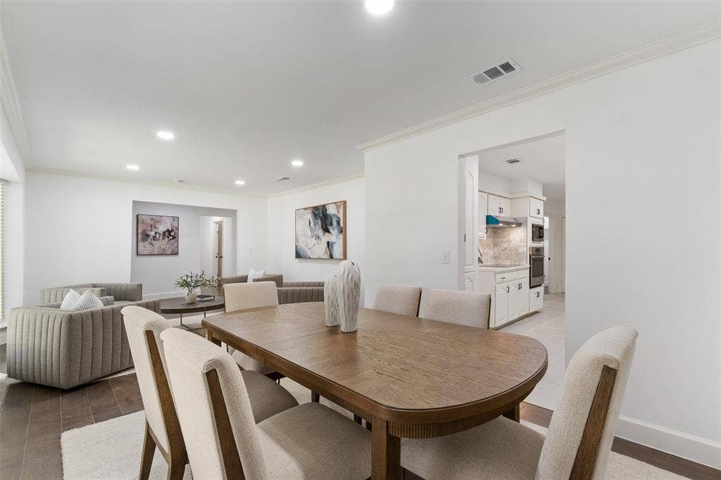 1612 Northcrest Drive, Plano, TX 75075 Recessed lighting, crown molding, wood-finish flooring, white cabinetry, and built-in kitchen appliances