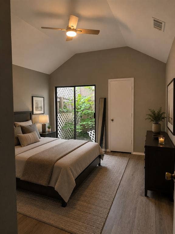1120 Old Barn Lane, Mesquite, TX 75149 Vaulted ceiling with an attached ceiling fan, large glass sliding door, and wood-finish flooring
