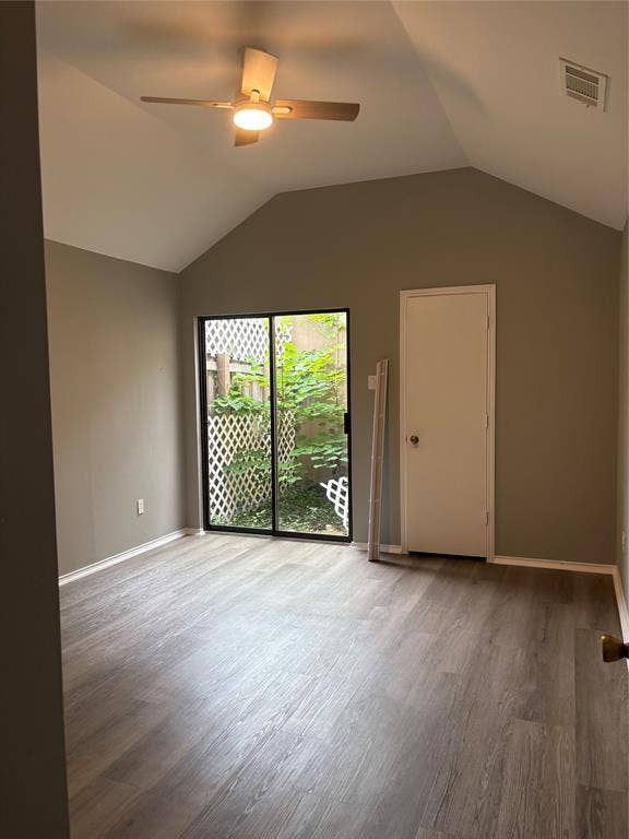 1120 Old Barn Lane, Mesquite, TX 75149 Vaulted ceiling, wood-finish flooring, ceiling fan with integrated lighting, sliding glass door, and a private patio with lattice fencing