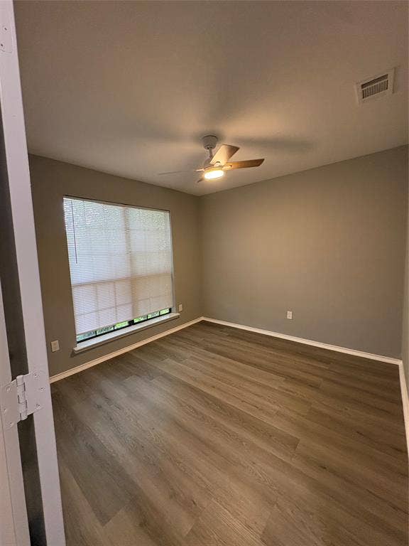 1120 Old Barn Lane, Mesquite, TX 75149 Wood-finish flooring throughout, complemented by a ceiling fan with integrated lighting