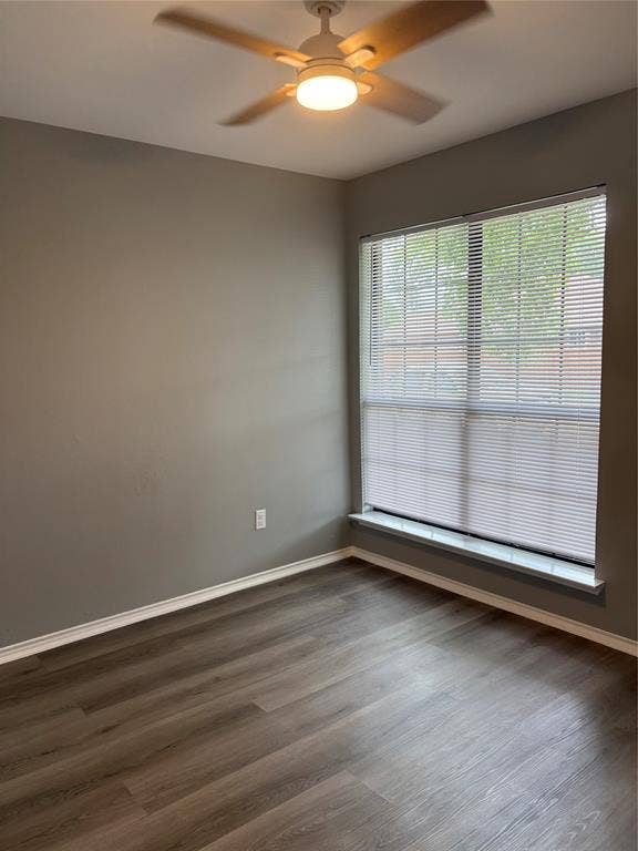 1120 Old Barn Lane, Mesquite, TX 75149 Wood-finish flooring, neutral wall tones, window with horizontal blinds, and a ceiling fan with integrated lighting