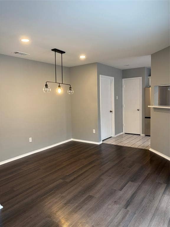 1120 Old Barn Lane, Mesquite, TX 75149 Recessed ceiling lighting, wood-finish flooring, modern linear chandelier, neutral wall tones, and white interior doors