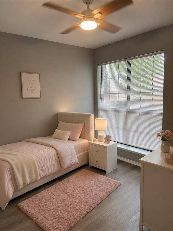 1120 Old Barn Lane, Mesquite, TX 75149 Wood-finish flooring with a neutral wall color, large window with blinds, and a ceiling fan with integrated lighting