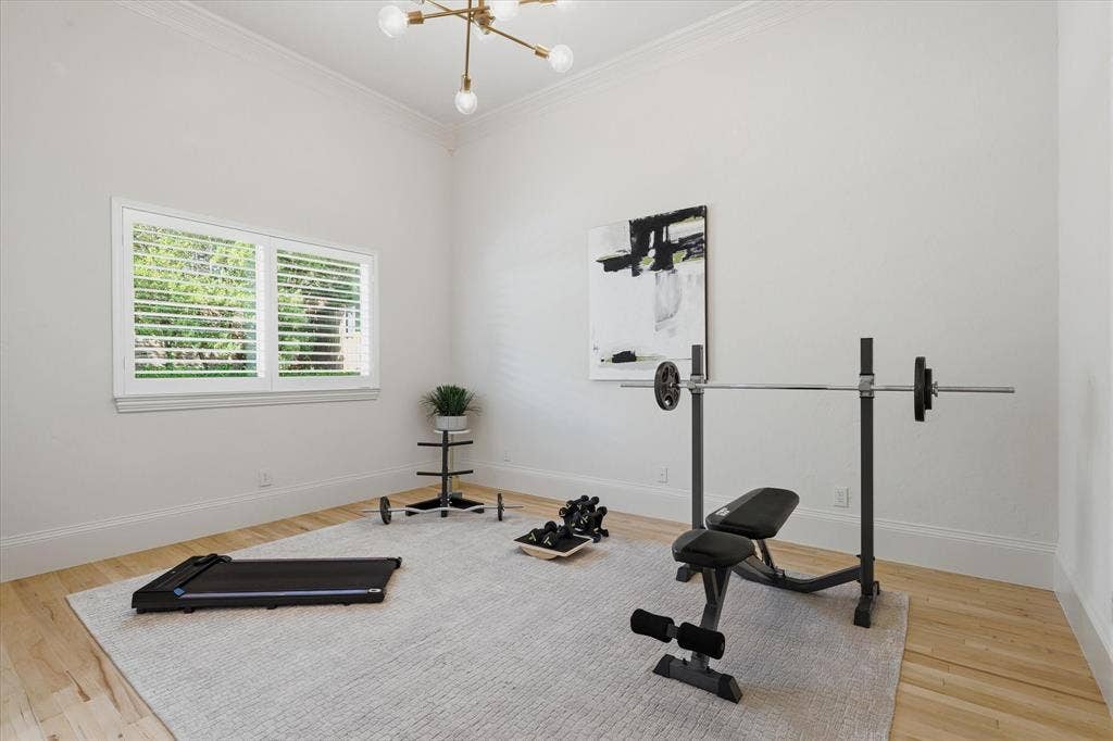 First floor guest bedroom is currently utilized as a home gym.