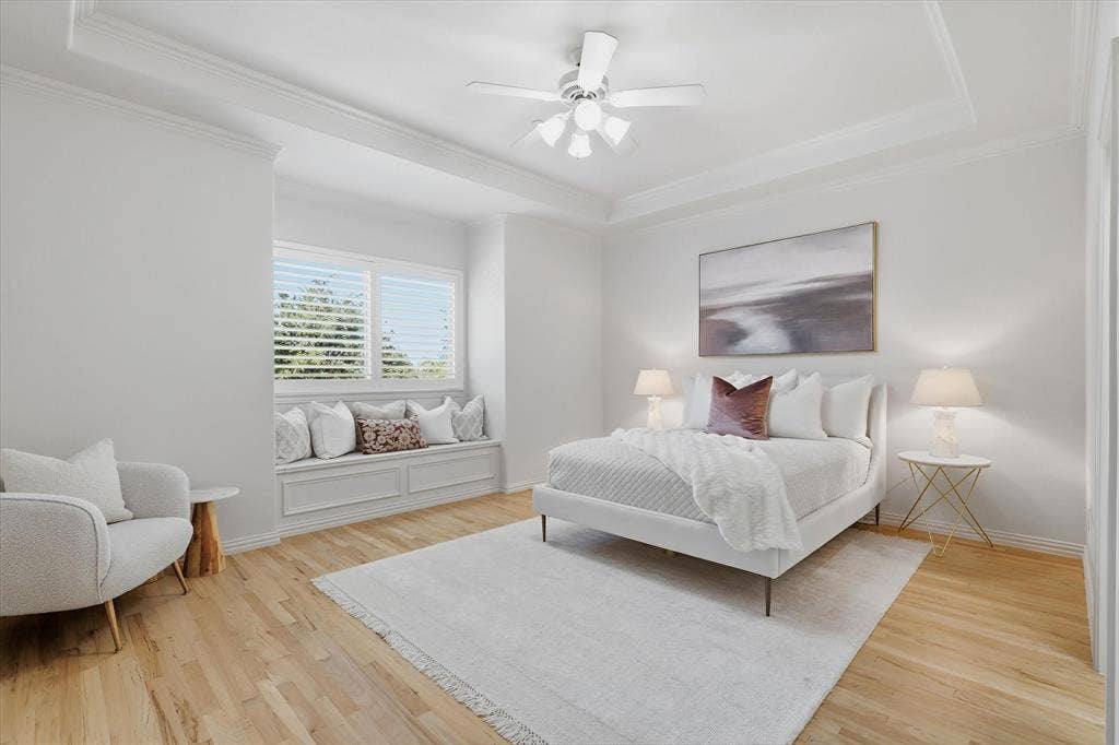 A second upstairs bedroom continues the home's light, refined palette and generous proportions.