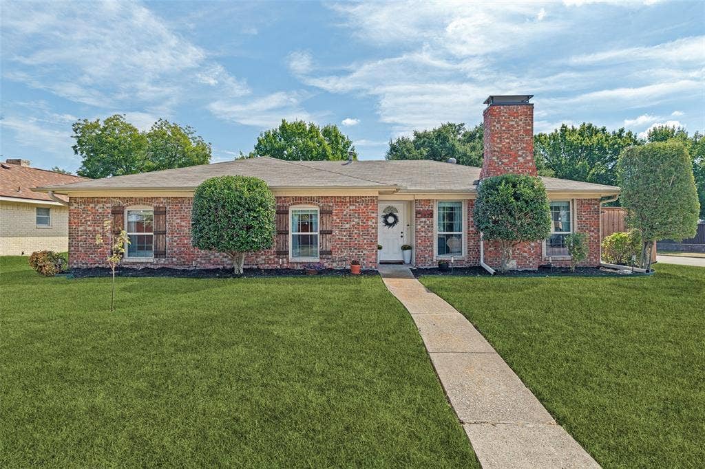 822 Century Park Drive, Garland, TX 75040 Brick exterior, freshly landscaped. Grass has been digitally enhanced.