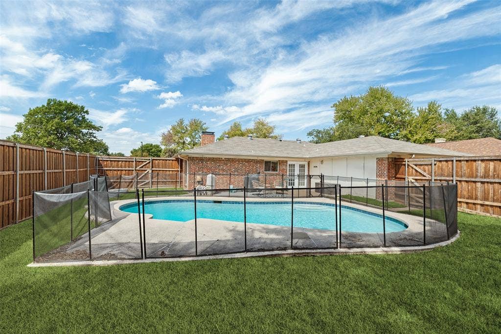 822 Century Park Drive, Garland, TX 75040 Recently replastered pool with security fencing