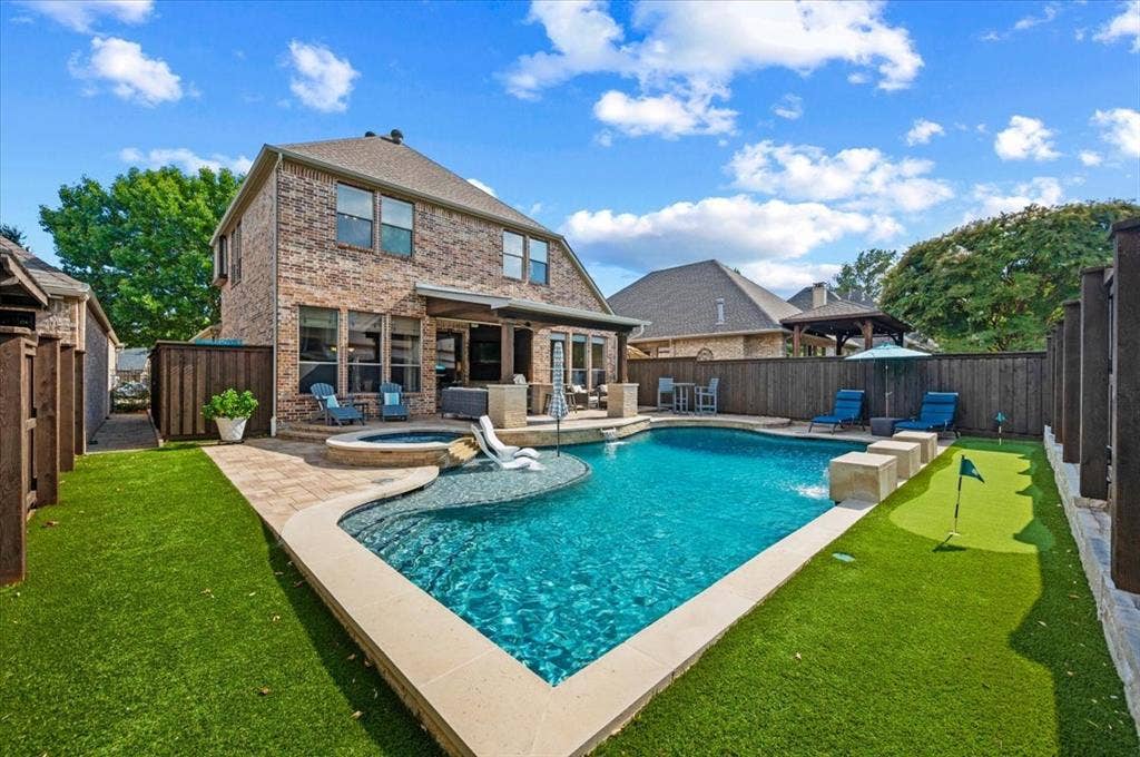 1900 Brookfield Way, McKinney, TX 75072 Sparkling pool, spa, putting green, outdoor kitchen, multiple dining and lounging areas.