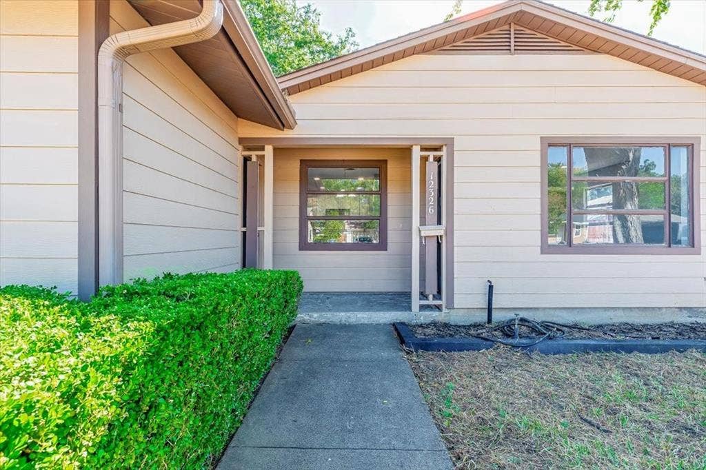 12326 Dandridge Drive, Dallas, TX 75243 Siding exterior with contrasting trim accents and multiple windows