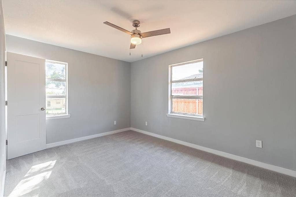 12326 Dandridge Drive, Dallas, TX 75243 Recessed lighting, ceiling fan with integrated light, two windows, and gray carpeting