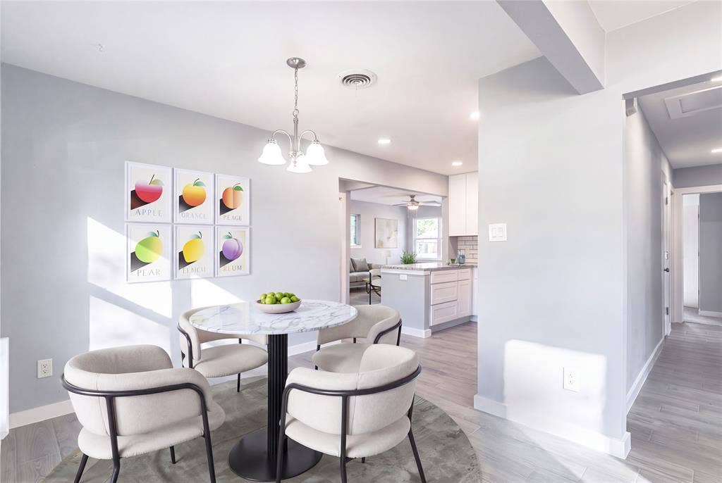12326 Dandridge Drive, Dallas, TX 75243 Dining area with wood-finish flooring and a contemporary chandelier