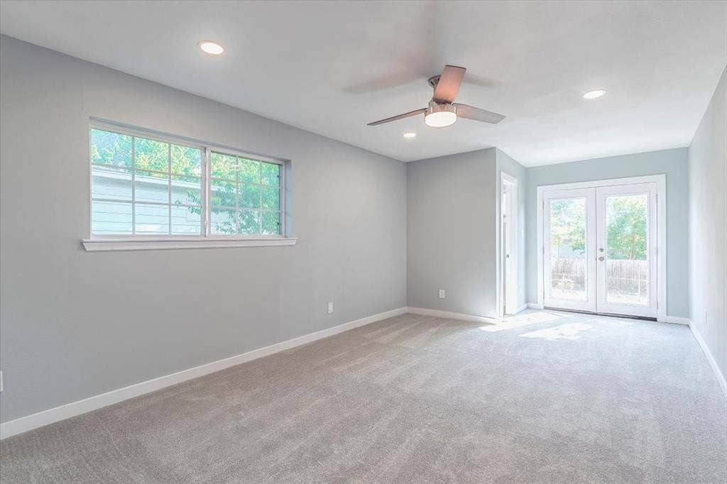 12326 Dandridge Drive, Dallas, TX 75243 Recessed ceiling lighting, ceiling fan with integrated light, light gray tile double French doors, and a large window