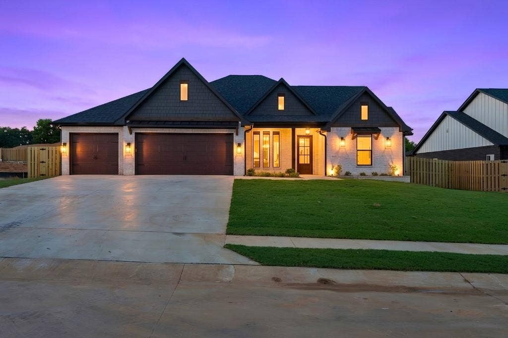 Modern farmhouse exterior with white brick and dark siding accents