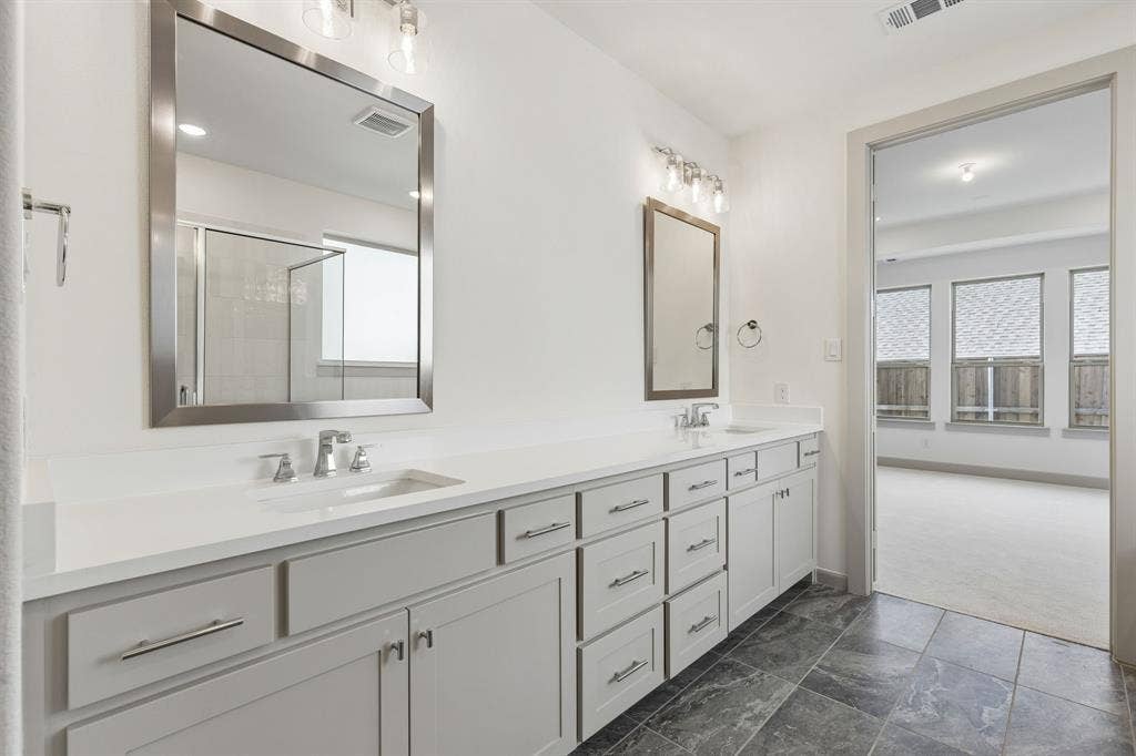 6901 Chief Spotted Tail Drive, McKinney, TX 75070 Plenty of space for two in this wonderful owner's bath.