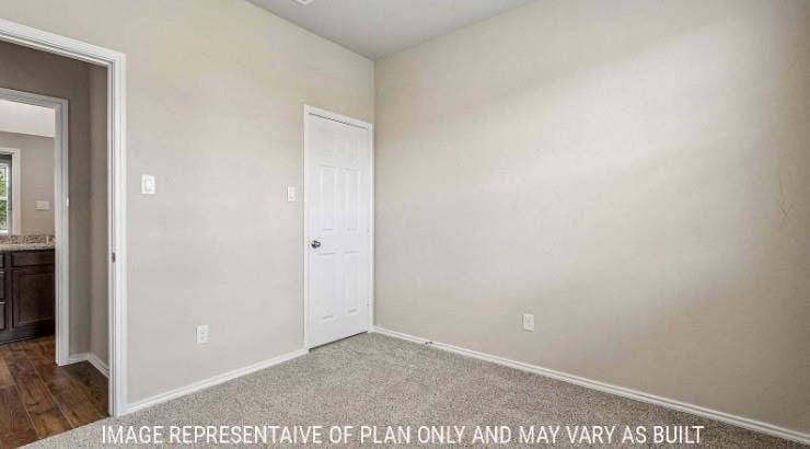 Plush grey carpeting and light neutral wall paint
