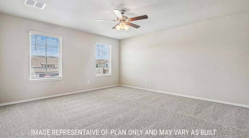 Carpeted flooring, dual windows with blinds, ceiling fan with integrated lighting, and neutral wall tones