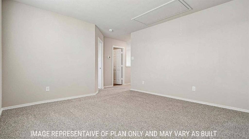 Spacious interior room featuring neutral wall finishes, neutral carpet flooring, and recessed ceiling lighting