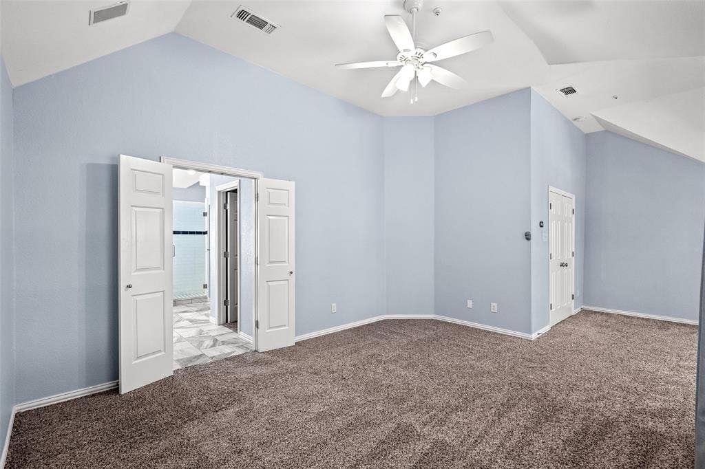 14592 Aspen Court, Addison, TX 75001 Vaulted ceilings with a ceiling fan, carpeted flooring, and light blue wall finish