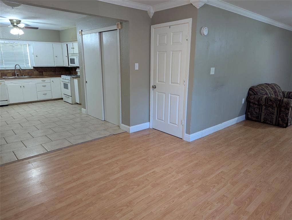 111 Murchison Street, Farmersville, TX 75442 Open transition from the living area into the dining and into the kitchen.