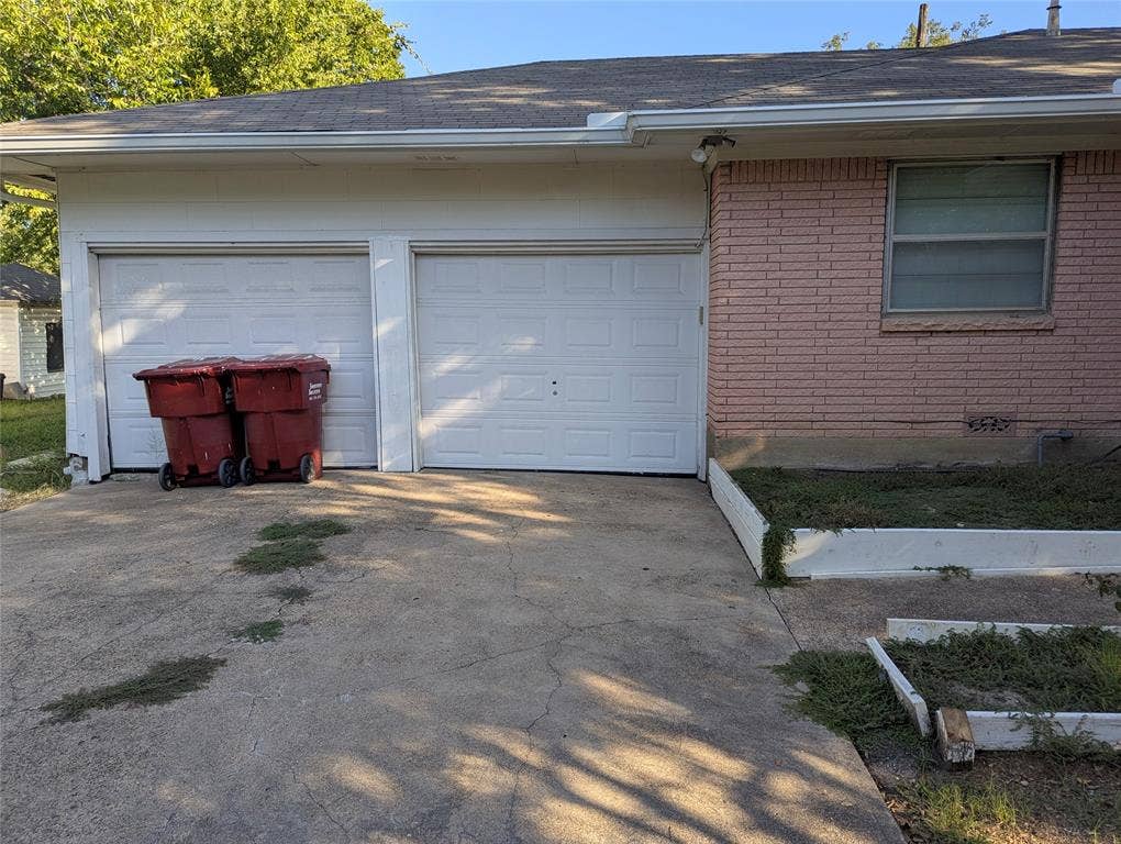 111 Murchison Street, Farmersville, TX 75442 Attached 2-car garage with driveway access.