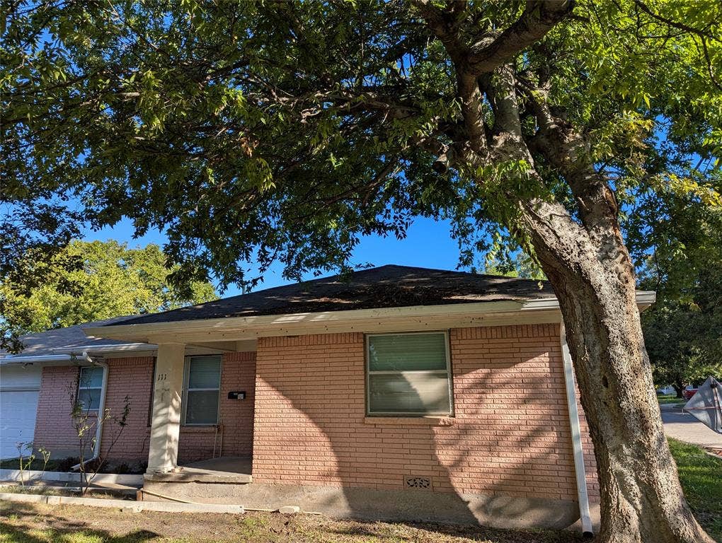 111 Murchison Street, Farmersville, TX 75442 Mature trees provide abundant shade and character to this brick home, complete with a covered front porch and corner-lot setting.