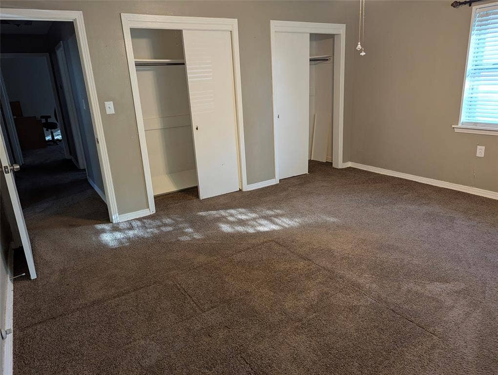 111 Murchison Street, Farmersville, TX 75442 Another view of Bedroom #3, highlighting two closets, neutral wall colors, and front yard views. Flexible space for a bedroom, guest room, or home office!