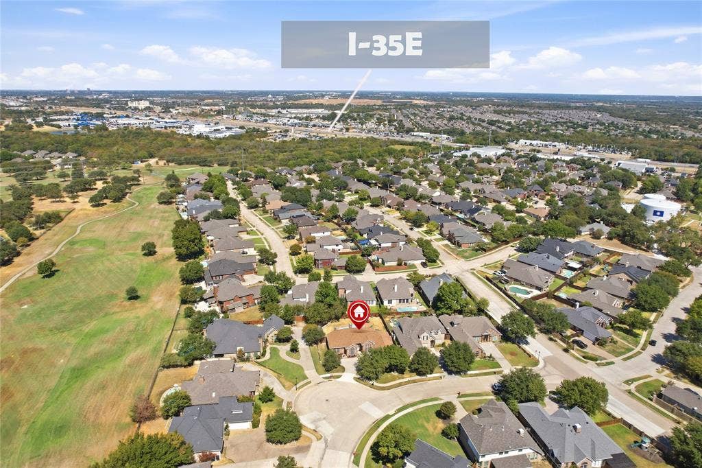 1926 Vintage Drive, Corinth, TX 76210 Residential property surrounded by mature trees, situated along a curbed street