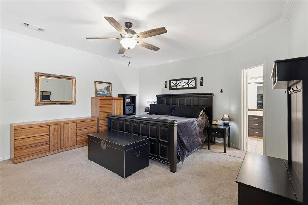 1926 Vintage Drive, Corinth, TX 76210 Recessed ceiling fan with integrated lighting, crown molding, and carpet flooring