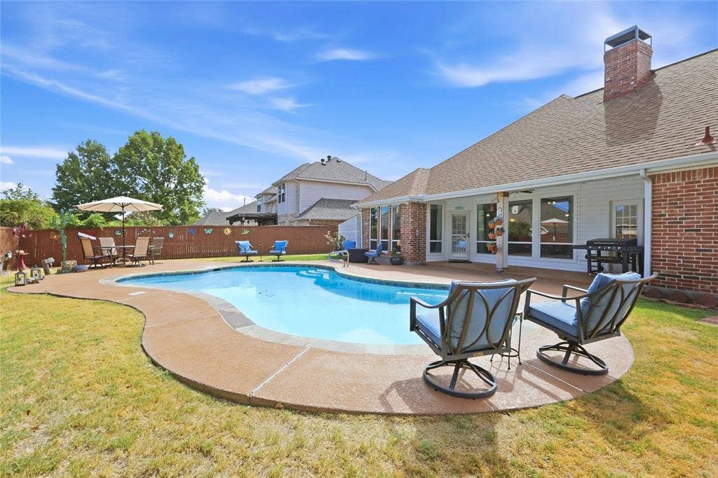 1926 Vintage Drive, Corinth, TX 76210 In-ground swimming pool with surrounding concrete decking