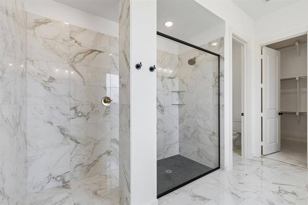 15756 Split Bark Lane, Frisco, TX 75033 Your new owner's bath features a spacious walk in shower with drying area!