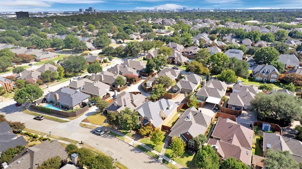1920 Keystone Drive, Plano, TX 75075 Densely developed residential area featuring mature trees and a distant city skyline