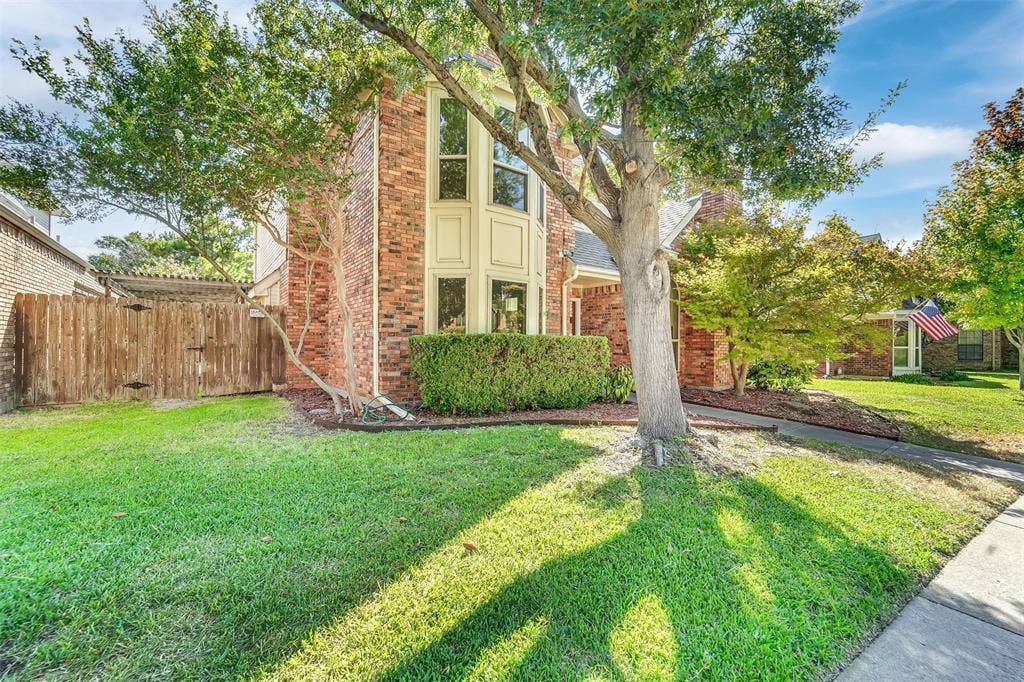 1920 Keystone Drive, Plano, TX 75075 Brick exterior with a prominent bay window, mature trees, and a well-maintained lawn