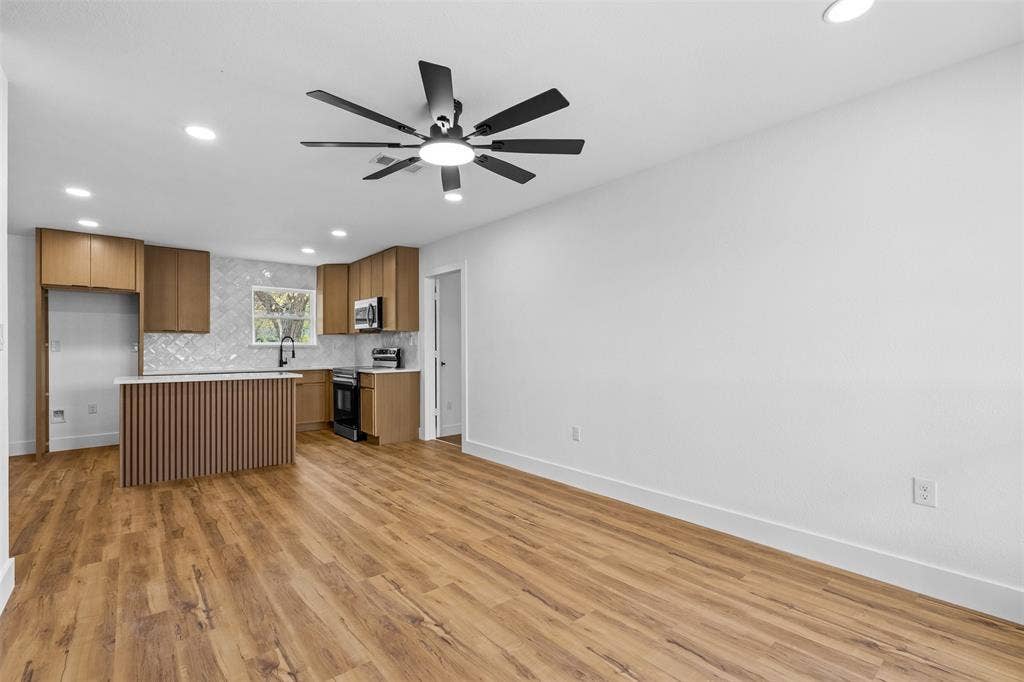565 alcorn Avenue, Dallas, TX 75217 Wood-finish flooring throughout, recessed lighting, and a modern ceiling fan