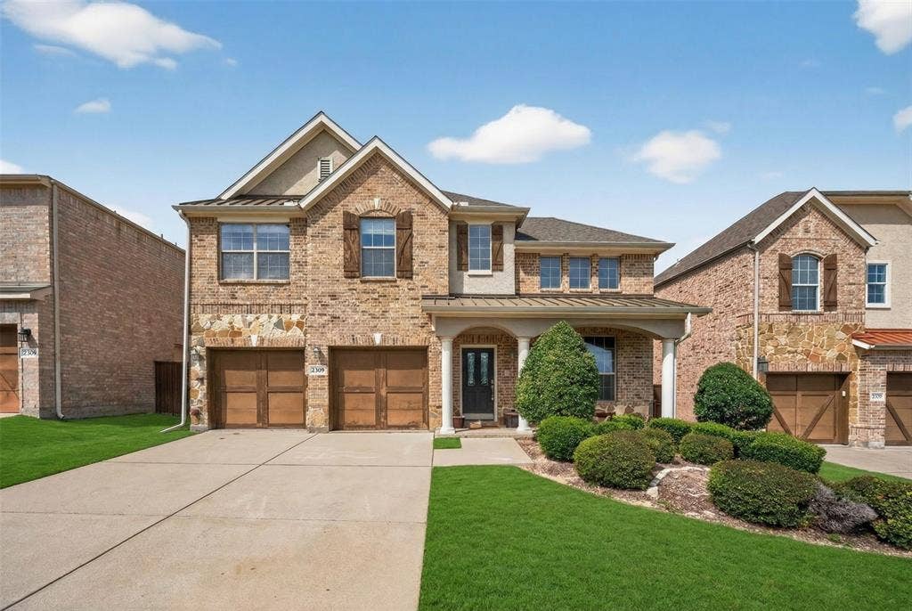 2309 Shingle Lane, Plano, TX 75074 Brick and stone exterior with decorative window shutters