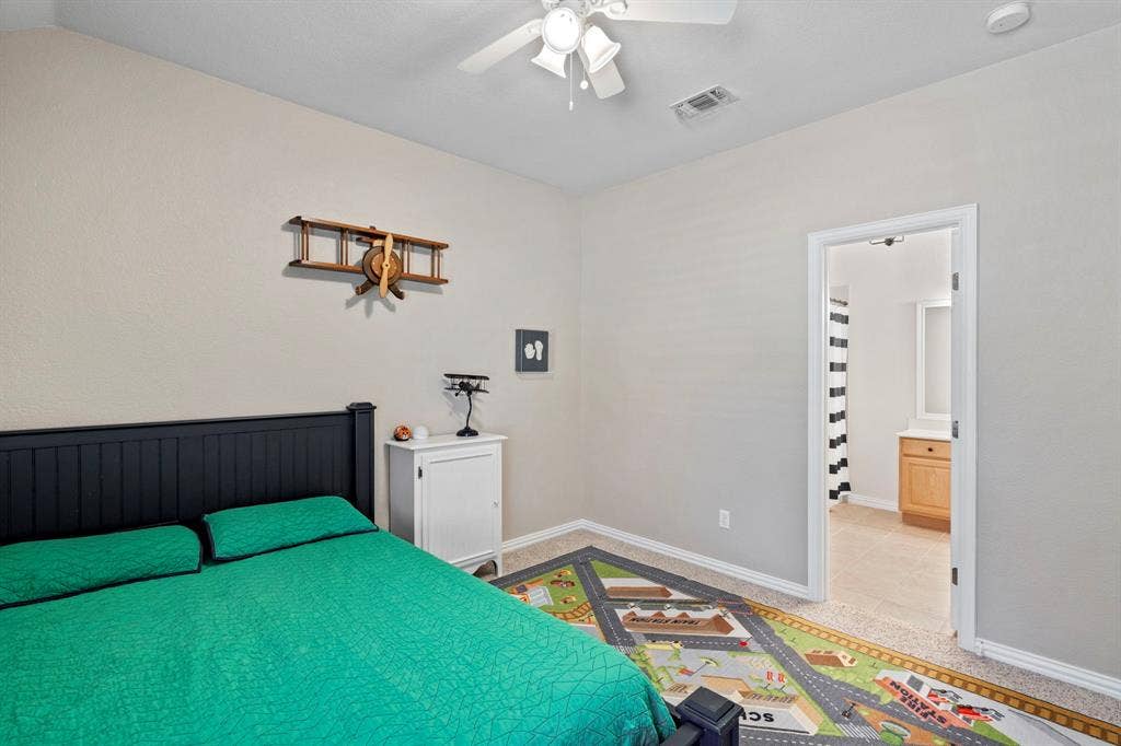 11701 Cambria Court, Fort Worth, TX 76008 Bedroom with neutral wall color and carpeted flooring