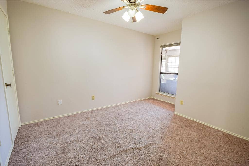 1328 Colmar Drive, Plano, TX 75023 Neutral-toned carpet flooring, light-colored walls, and a ceiling fan with integrated lighting
