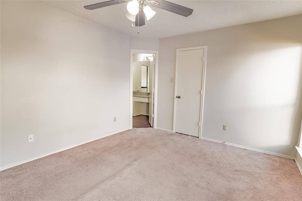 1328 Colmar Drive, Plano, TX 75023 Wall-to-wall carpeting, ceiling fan with light fixture, and an interior door