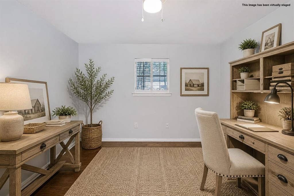 104 Trailwood Court, Burleson, TX 76028 This image is virtually staged as an office. This room could be used as a flexible bedroom or creative space featuring closet storage and access to the utility and garage.