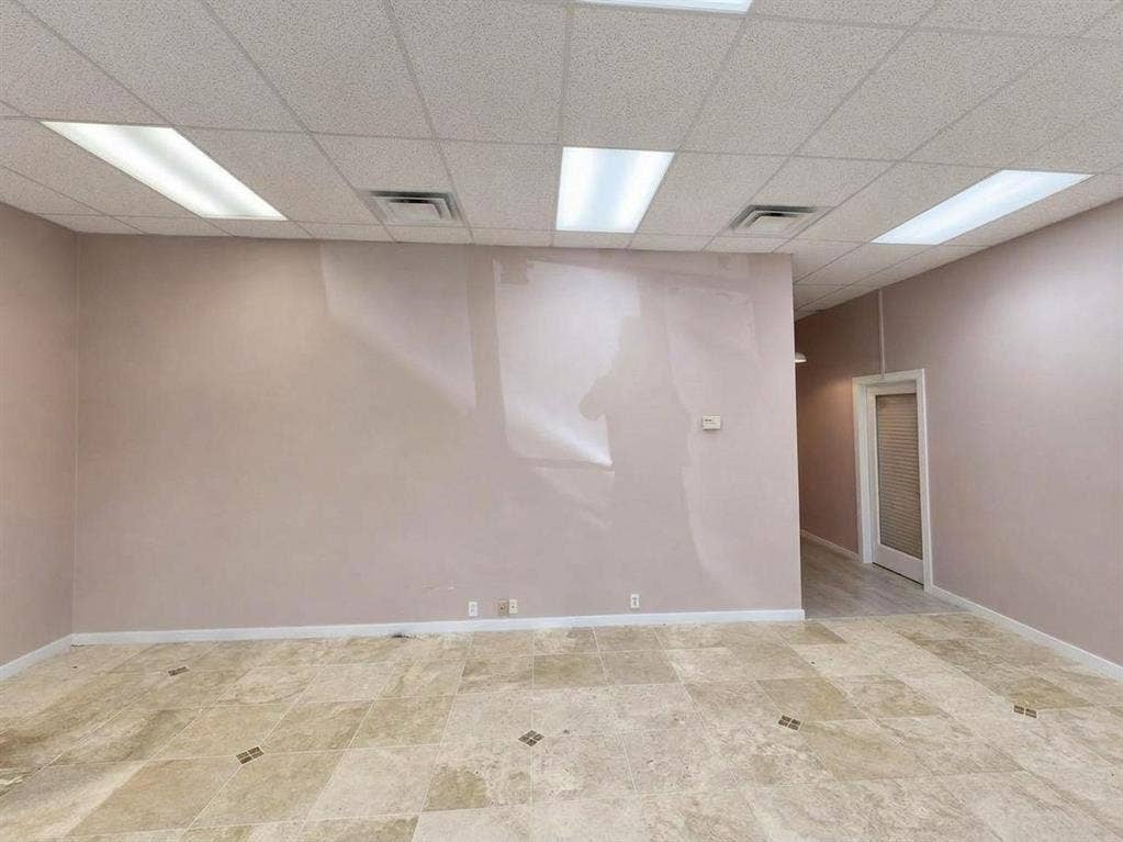 607 Cedar Street, Cedar Hill, TX 75104 Recessed lighting, tile flooring with decorative accents, drop ceiling, and a white interior door with a textured glass panel