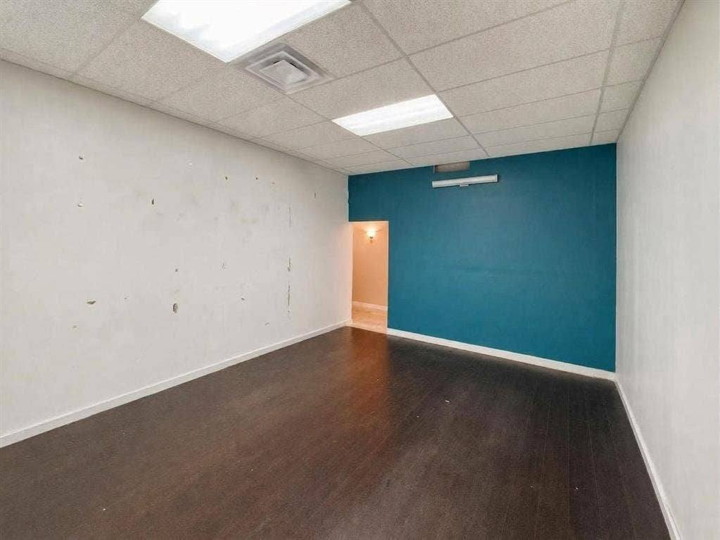 607 Cedar Street, Cedar Hill, TX 75104 Recessed lighting, drop ceiling, wood-finish flooring, two-tone painted walls, and built-in wall lighting