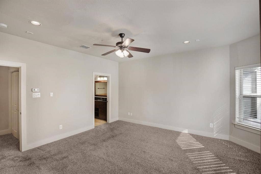 Recessed lighting, ceiling fan, carpeted flooring, window with blinds, and white trim