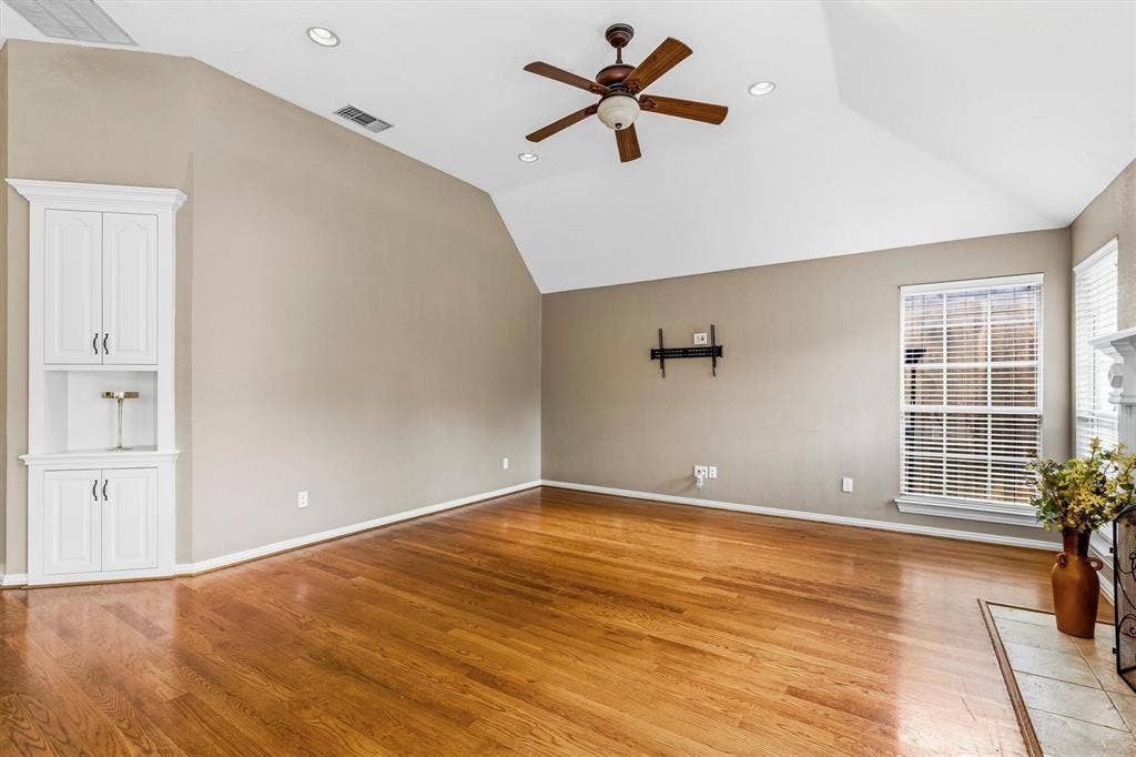 3916 Montrose Drive, Plano, TX 75025 Vaulted ceilings, wood-finish flooring, built-in cabinetry, ceiling fan, and recessed lighting