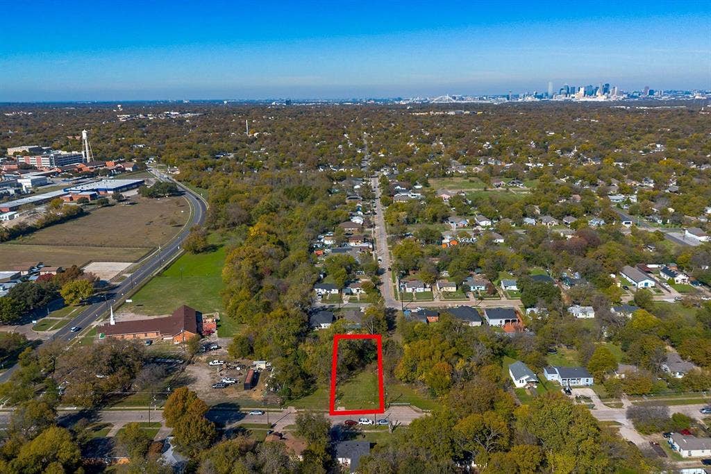 2433 52nd Street, Dallas, TX 75216 Vacant lot with surrounding mature trees, offering a clear development opportunity