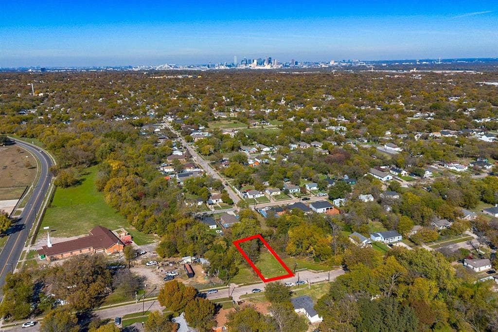 2433 52nd Street, Dallas, TX 75216 Expansive land parcel outlined in red, with a clear skyline visible in the distance