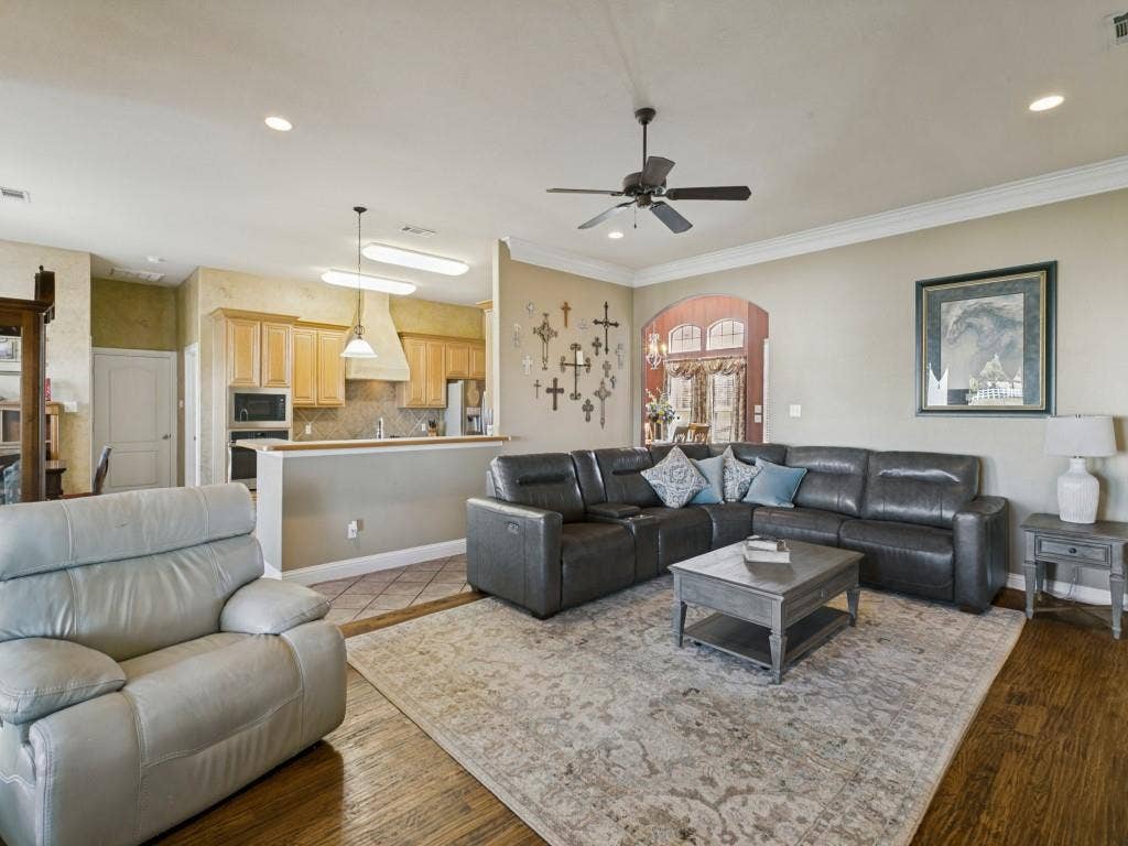 508 Singing Quail Trail, Haslet, TX 76052 Open-concept living area with wood-finish flooring, recessed lighting, and crown molding