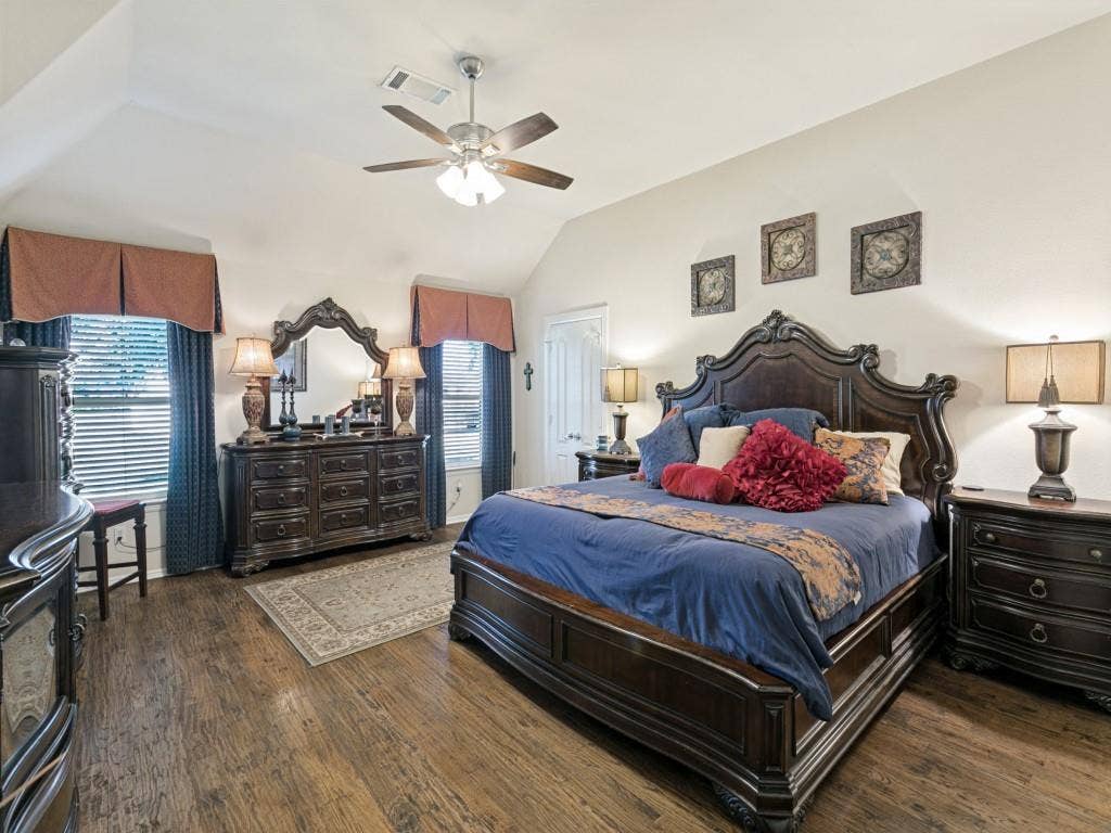 508 Singing Quail Trail, Haslet, TX 76052 Vaulted ceiling featuring a ceiling fan, wood-finish flooring, and multiple windows with blinds